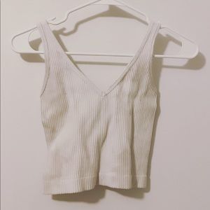 This white tank is a staple and is supper cut with baggy jeans and air forces